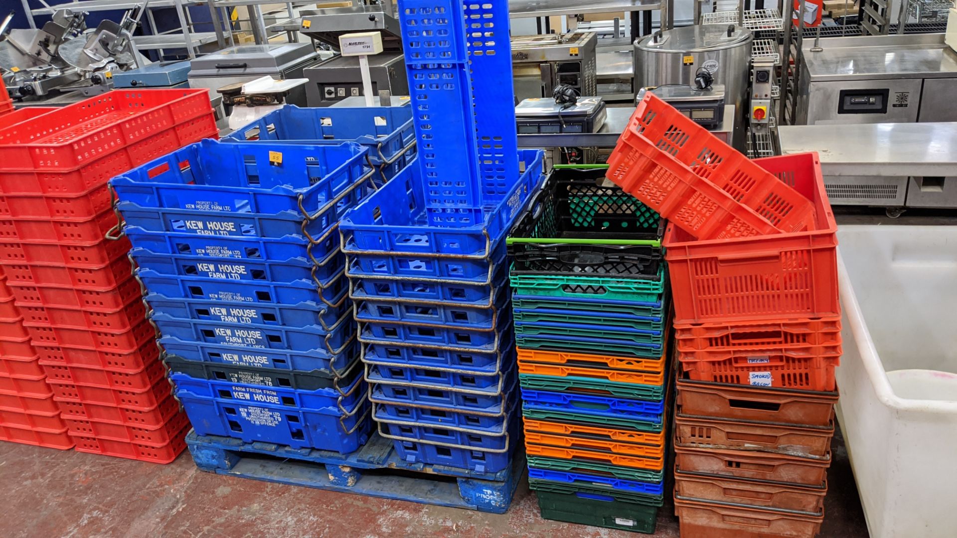 Large quantity of assorted plastic crates in 5 stacks. NB some of the crates have markings indicati