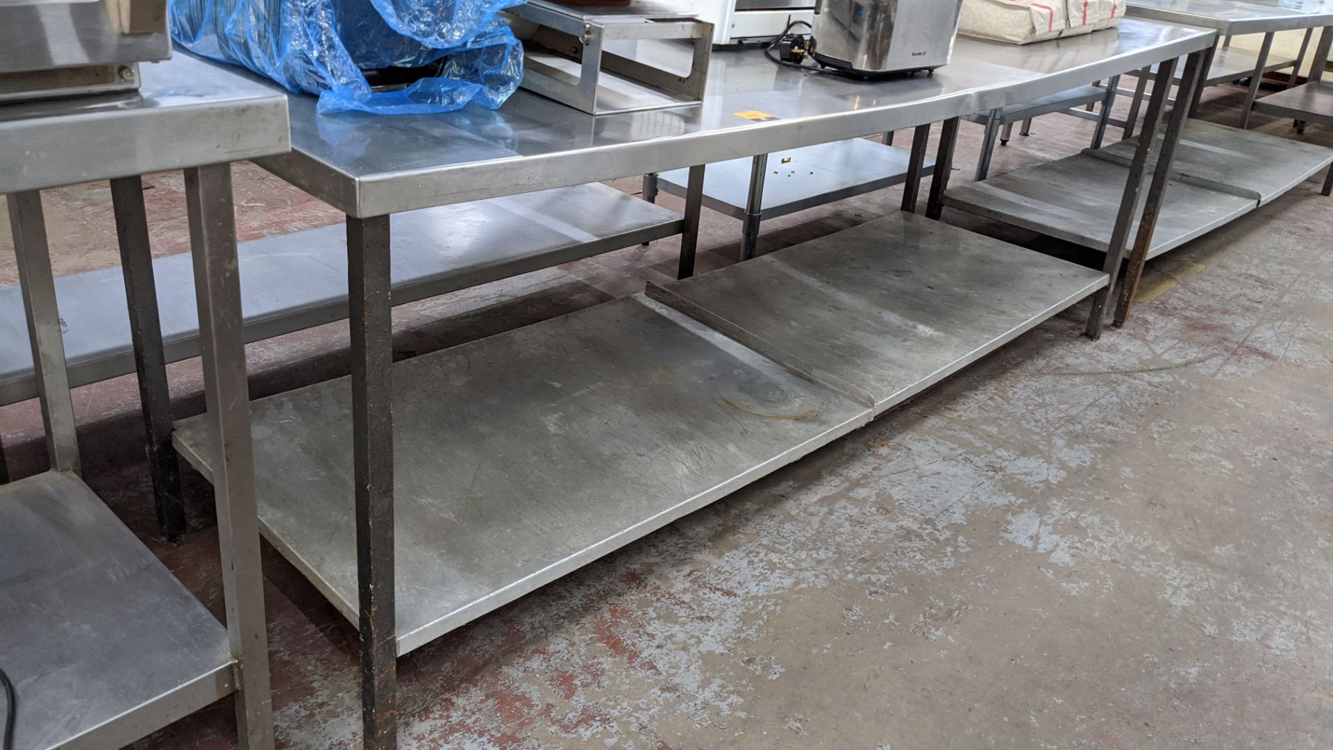 Large stainless steel twin tier table, table top measuring approximately 2065mm x 775mm