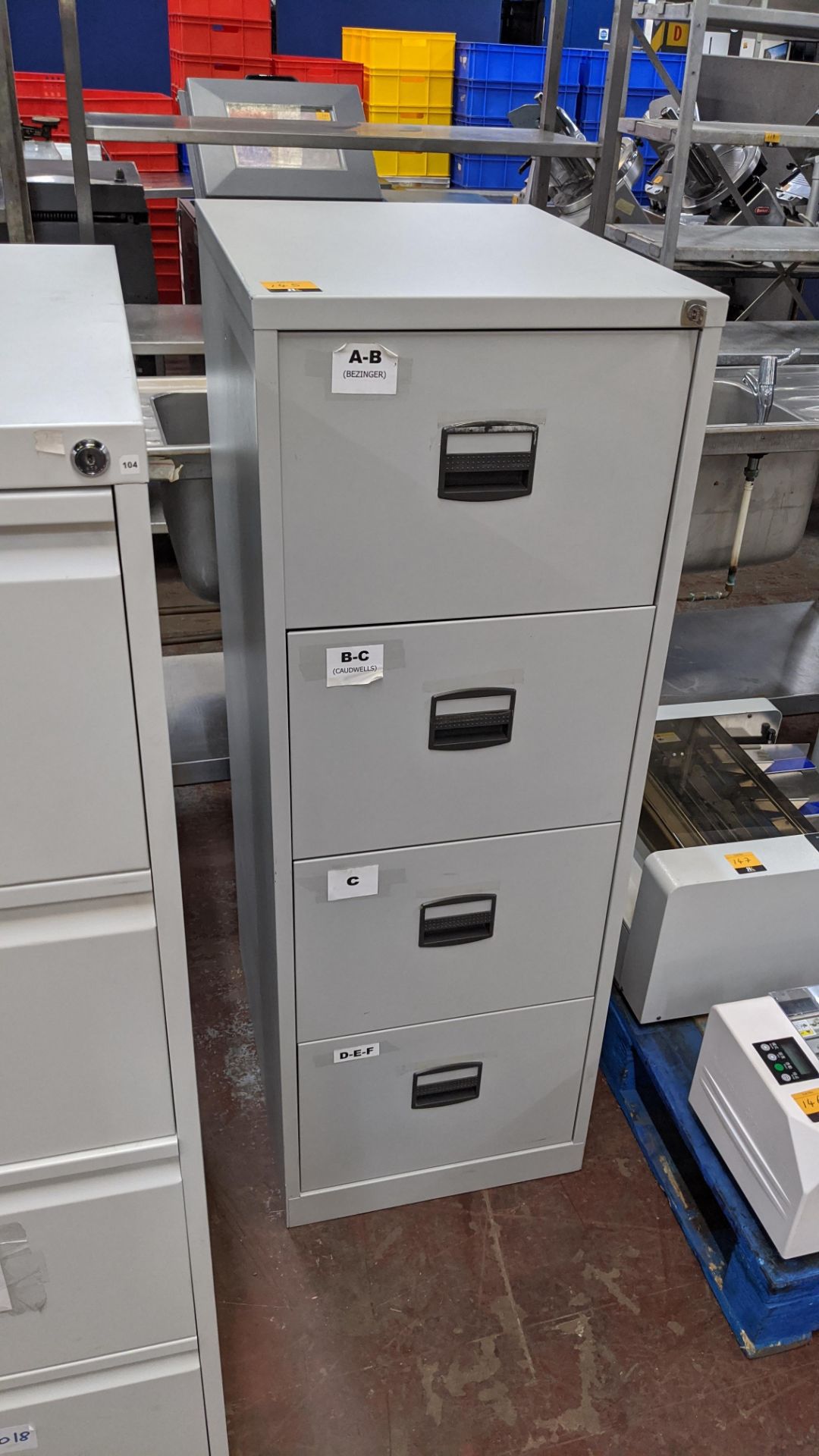 Grey metal 4-drawer filing cabinet