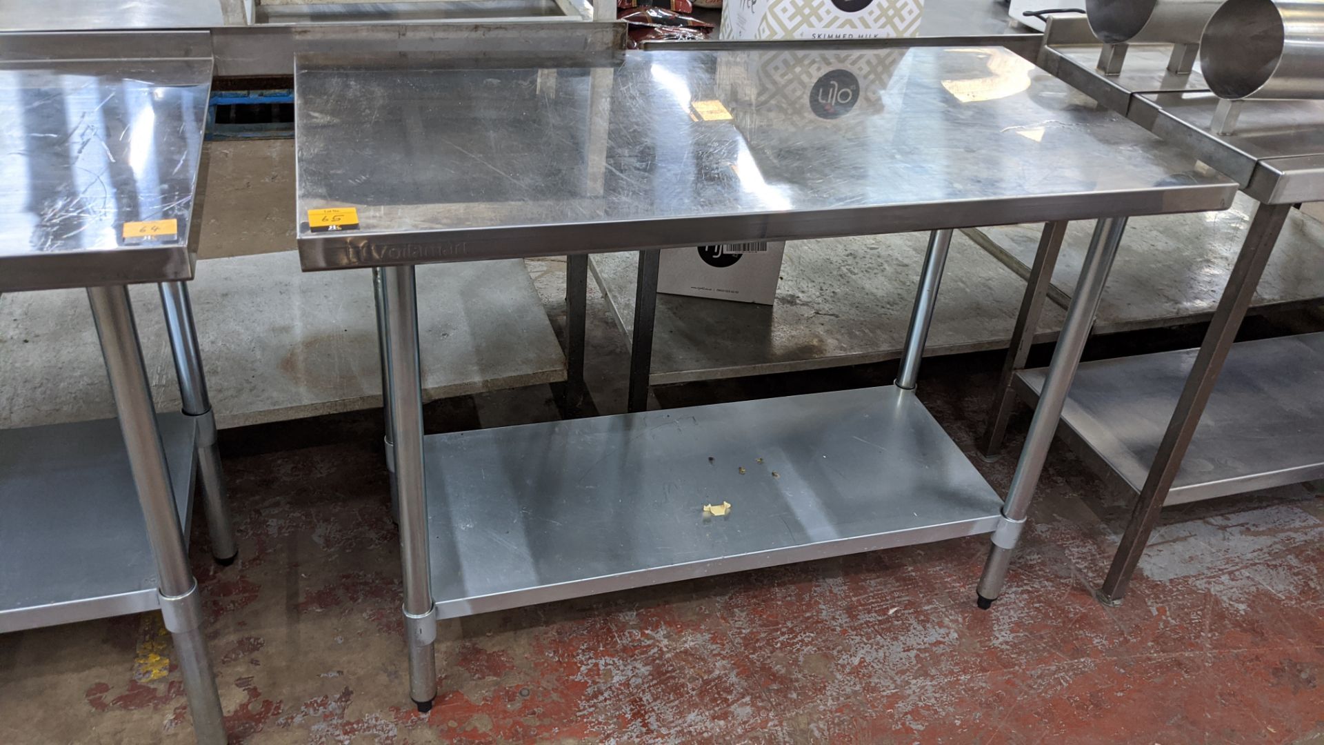 Stainless steel twin tier table, top measuring approximately 1220mm x 610mm - Image 2 of 3