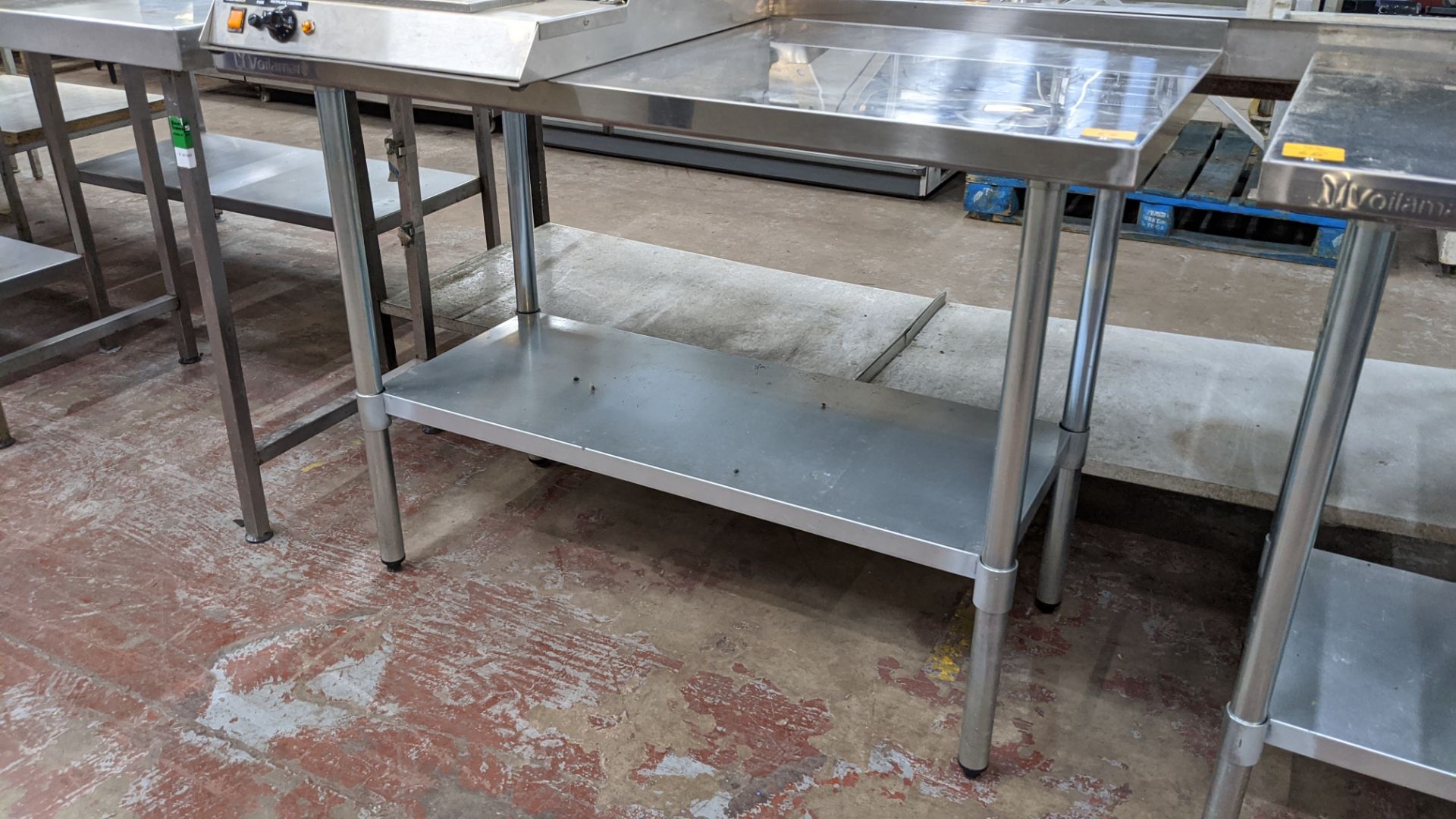 Stainless steel twin tier table, top measuring approximately 1220mm x 610mm