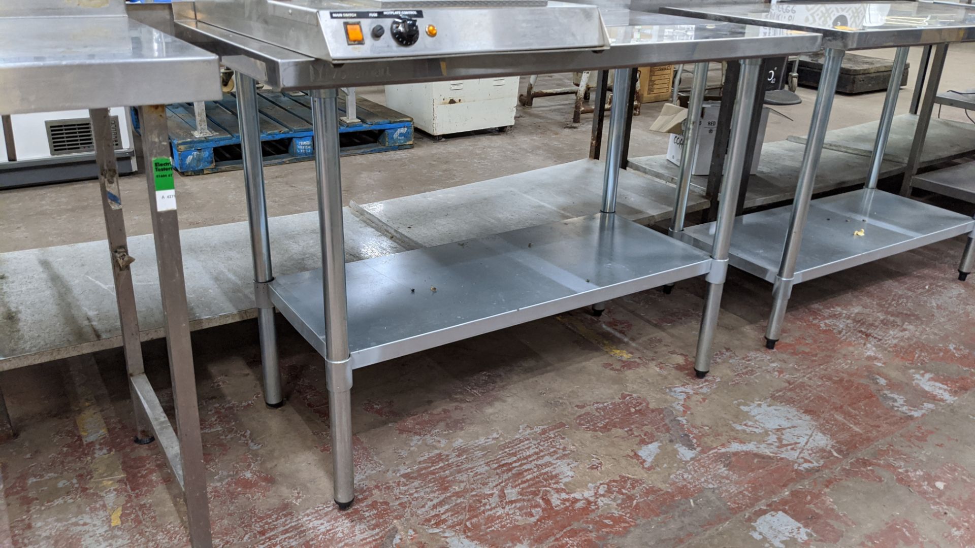 Stainless steel twin tier table, top measuring approximately 1220mm x 610mm - Image 3 of 3