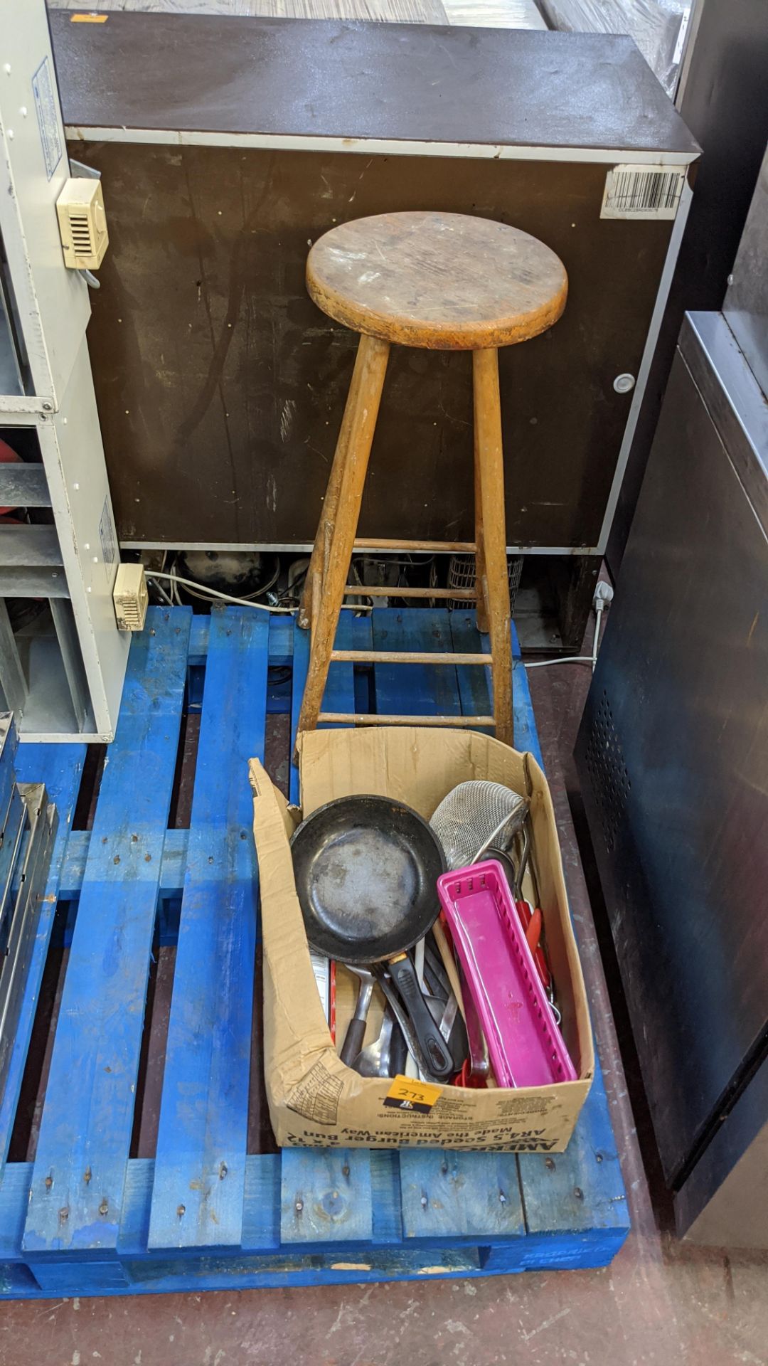 Box of assorted utensils plus wooden stool behind same