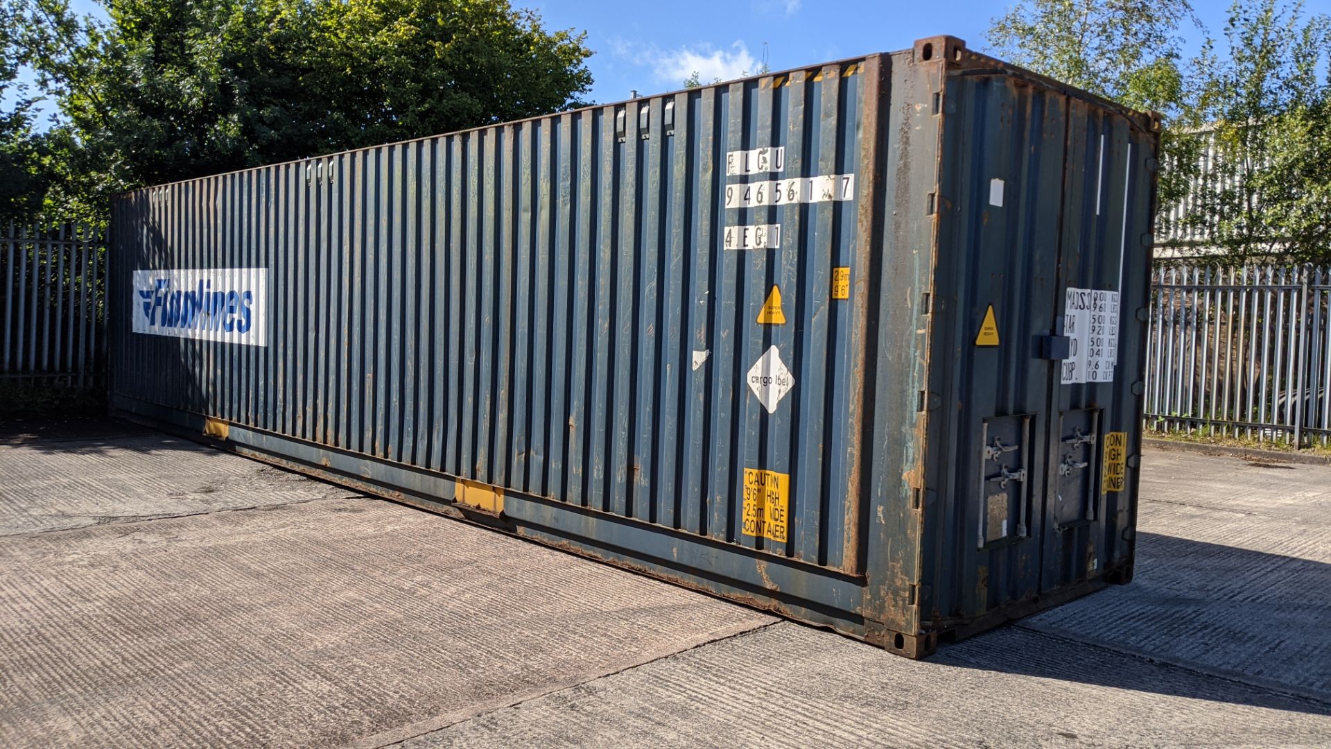 40ft steel shipping container (9'6" high) and contents of furniture, to be sold as one lot.