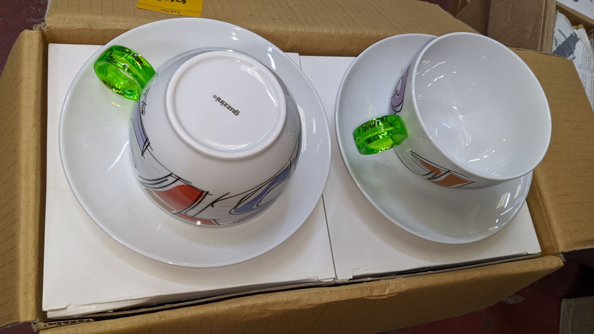 24 off Guzzini porcelain cups & saucers, with green clear handles, boxed in pairs, this lot consists - Image 4 of 4