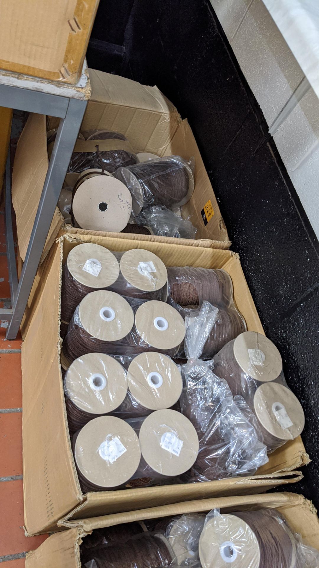 2 large boxes of brown cord on reels