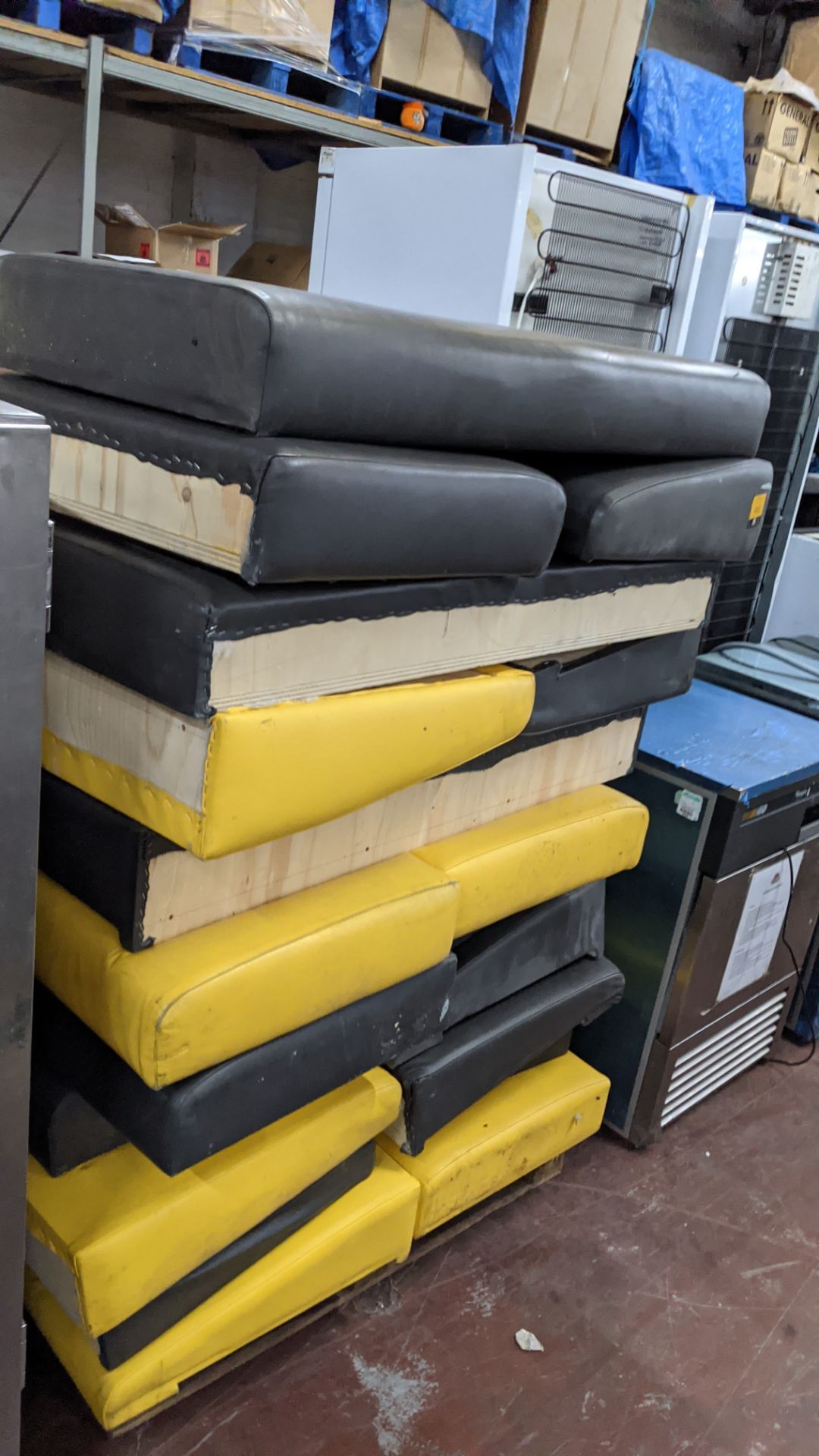 Stack of bench/banquet seating padded seat bases/backs