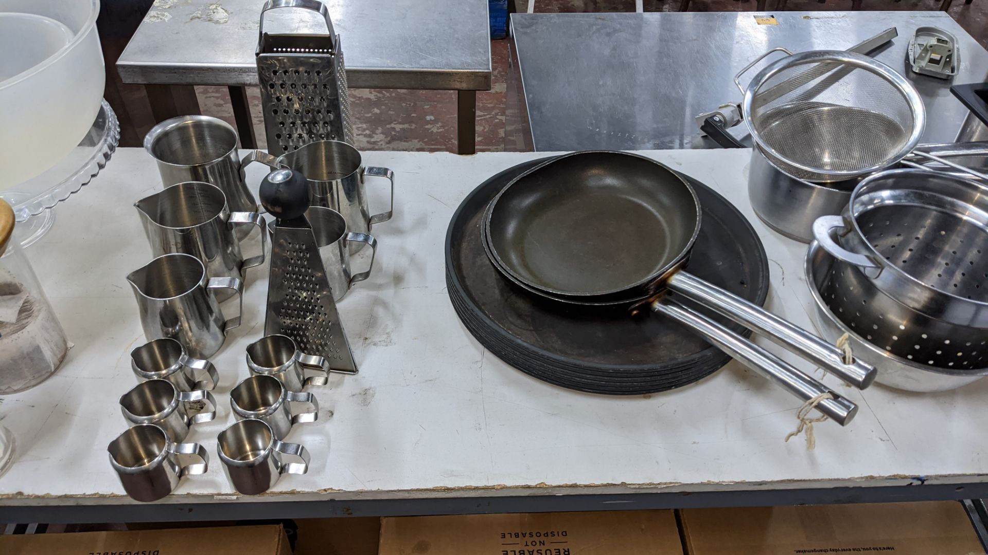 The contents of a table comprising jars, bowls, sugar dispensers, milk jugs, trays, strainers, pans - Image 4 of 5