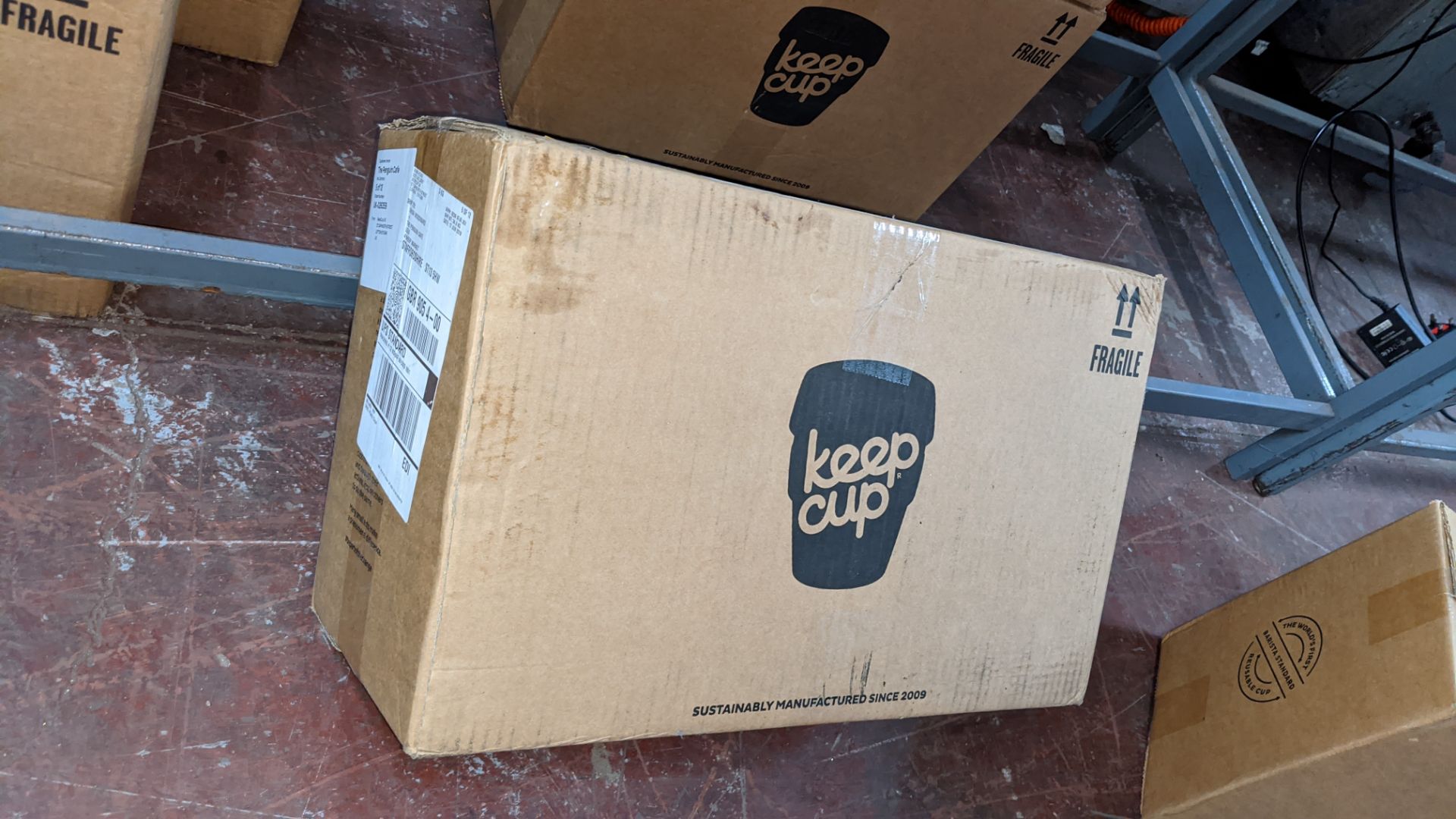 20 off Keepcup original reusable cup, size medium (12oz/340ml). Each unit is dark grey with a turqu
