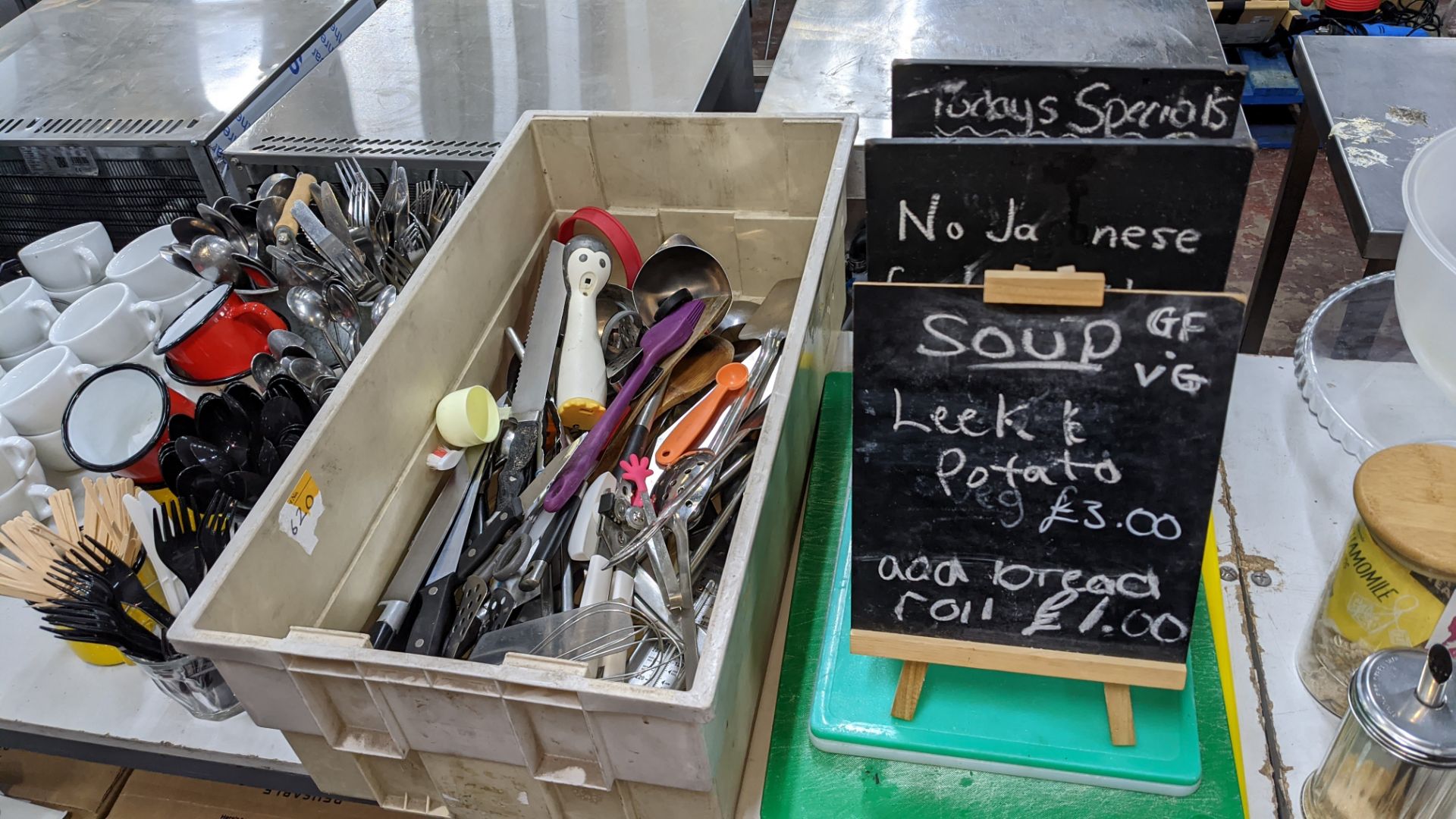 The contents of a table comprising white cups & saucers plus cutlery, utensils, chopping boards, min - Image 6 of 6