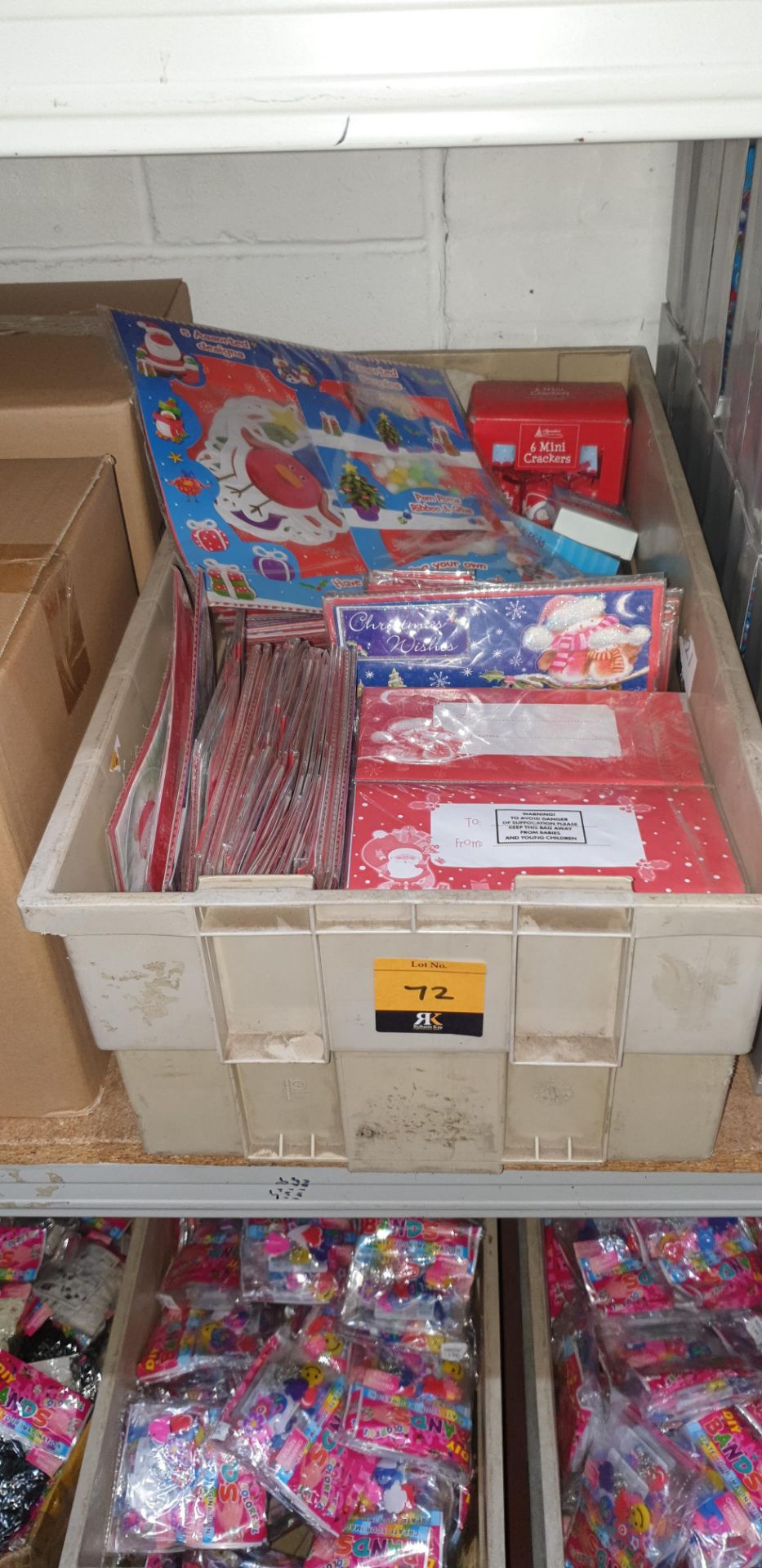 Contents of a crate of Christmas gift tags, mini crackers & other Christmas related items - crate ex