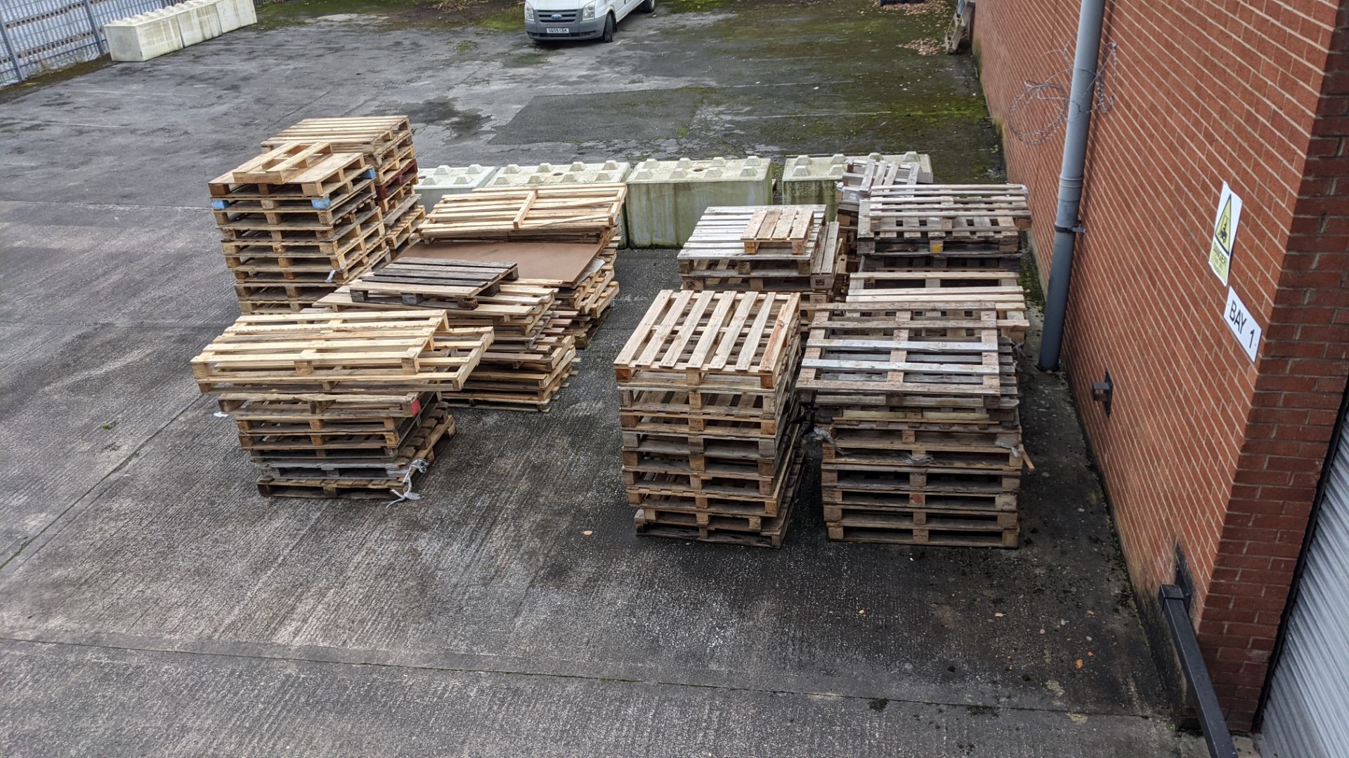 11 stacks of pallets, including regular size, euros, odd sizes and damaged. Approx 9-10 pallets per