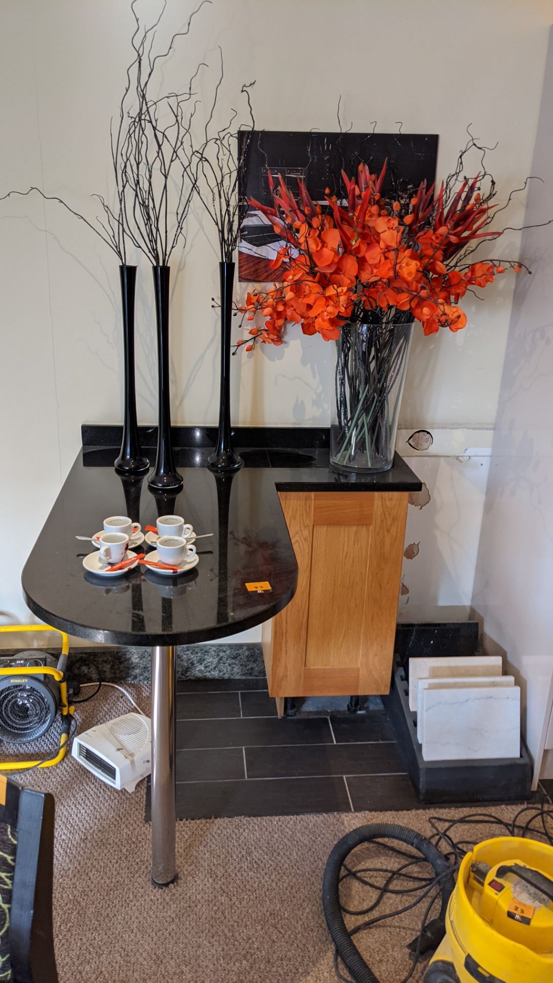 Small seating counter with cupboard underneath one end plus glass & china ornaments located on top o