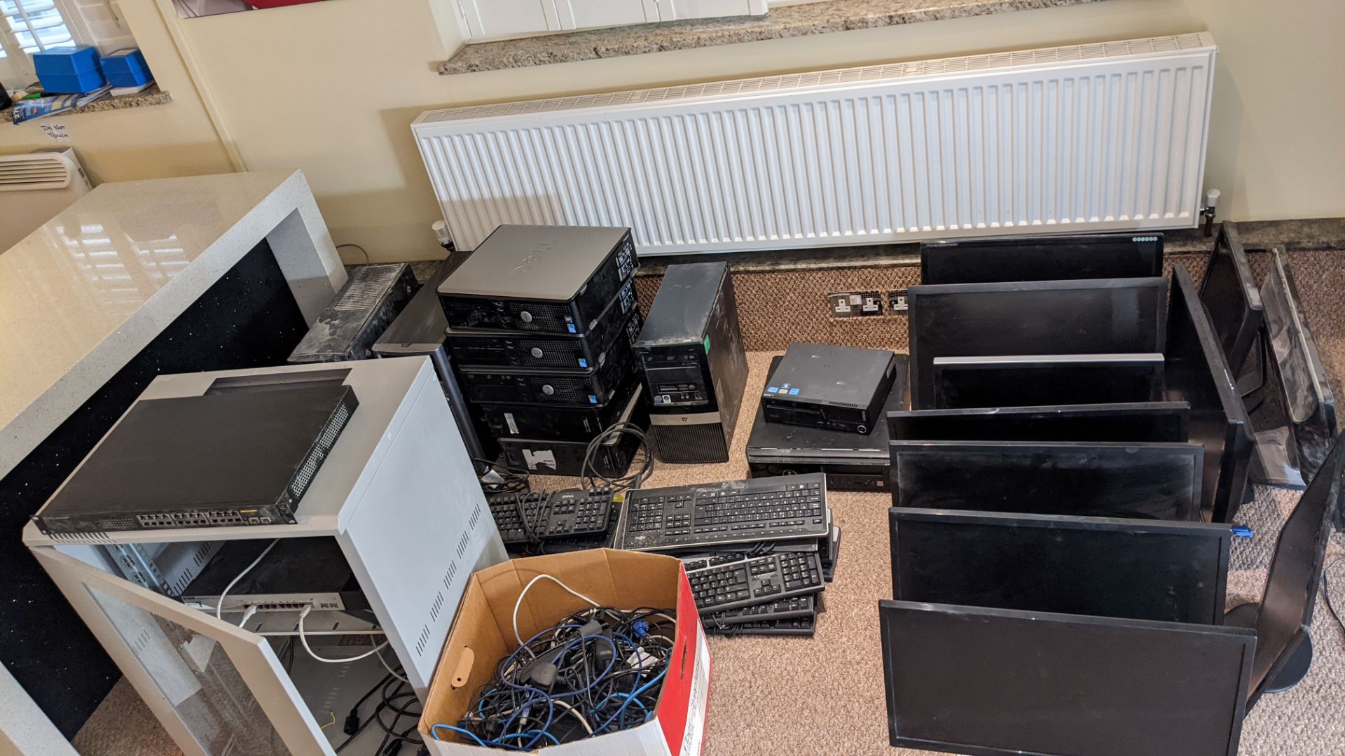 Quantity of IT equipment comprising router cabinet, approx. 10 desktop computers plus monitors, keyb