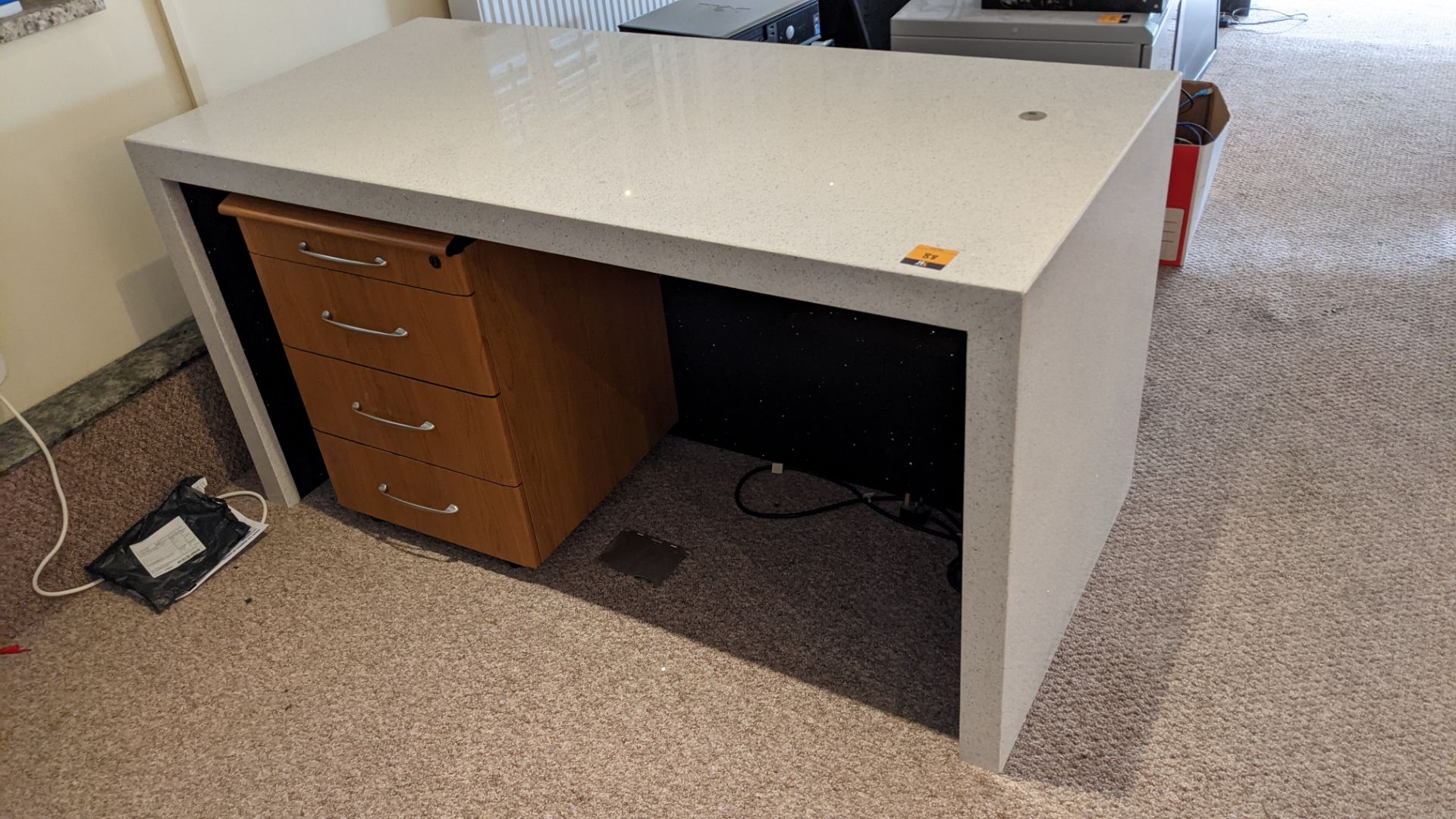 Granite/quartz desk arrangement with mitred corners including the freestanding pedestal