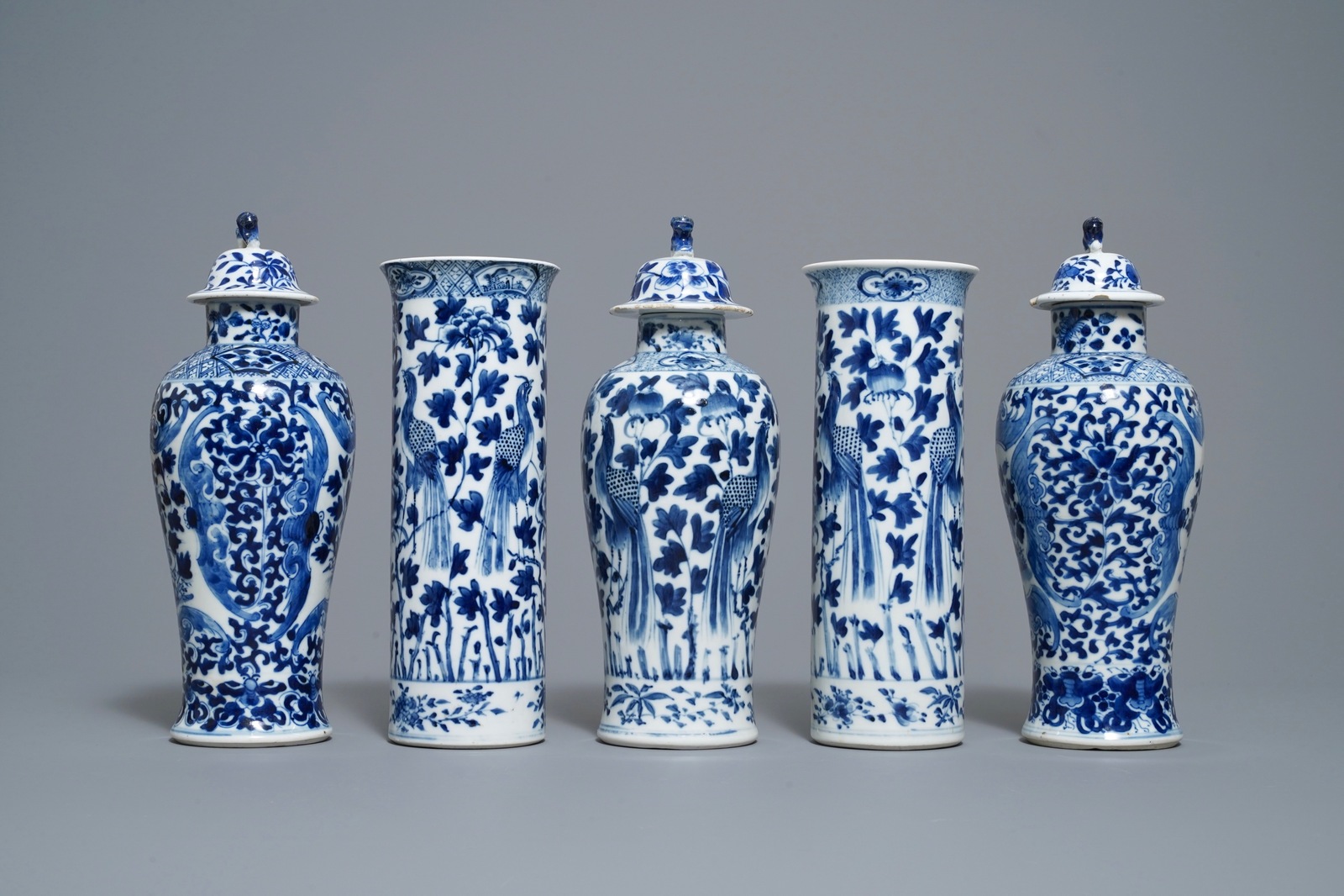 A Chinese blue and white five-piece garniture with peacocks, Kangxi mark, 19th C. - Image 2 of 8