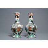 A pair of Chinese famille verte vases with figures on a terrace, Kangxi mark, 19th C.