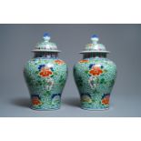 A pair of Chinese wucai vases and covers, Wanli mark, 19th C.