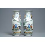 A pair of Chinese famille rose vases with travellers on a donkey, 19/20th C.