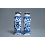 A pair of Chinese blue and white rouleau vases, Kangxi