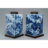 A pair of tall Chinese blue and white tea caddies with landscapes, 19th C.