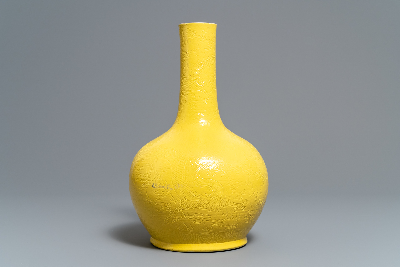 A Chinese monochrome yellow vase with underglaze dragon design, Zai Fu Tang Zhi mark, 19th C. - Image 4 of 7