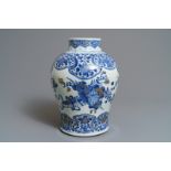 A Chinese gilt-decorated blue and white vase with floral design, Kangxi