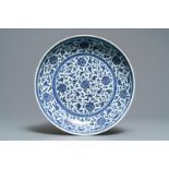 A Chinese Ming-style blue and white 'floral scroll' dish, Qianlong