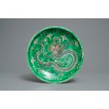 A Chinese verte biscuit 'dragon' charger, Kangxi mark, 19th C.