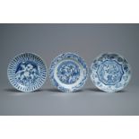 Three Chinese blue and white kraak porcelain 'deer' and 'prunus' plates, Wanli