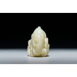 A Chinese celadon jade carving of two monkeys on a peach, 19th C.