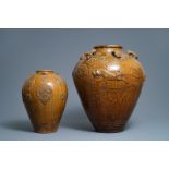 Two Chinese brown-glazed martaban jars with applied design, 18/19th C.