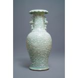 A large Chinese slip-decorated celadon-ground vase, 19th C.