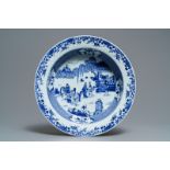 A deep Chinese blue and white dish with figures in a garden, Yongzheng