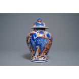 A Chinese blue and white clobbered 'qilin and phoenix' vase and cover, 19th C.