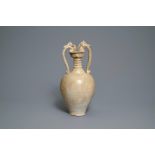 A Chinese cream-glazed stoneware amphora with dragon handles, Sui/Tang