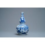 A Chinese blue and white double gourd vase, Transitional period