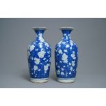 A pair of Chinese blue and white 'prunus on cracked ice' vases, 19th C.