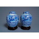 A pair of Chinese blue and white covered 'phoenix' jars, Kangi mark, 19th C.