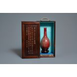 A Chinese monochrome sang-de-boeuf bottle vase in wooden presentation box, Republic