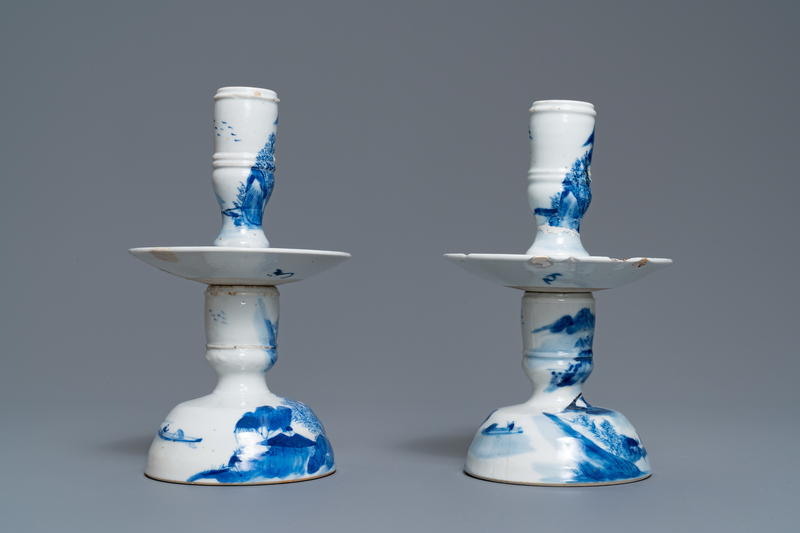 A pair of Chinese blue and white candlesticks and three famille rose figures of boys, 19th C. - Image 6 of 16