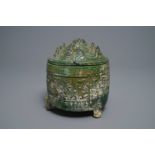 A Chinese green-glazed pottery tripod 'hill' jar, Han