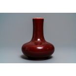 A Chinese monochrome red bottle vase, Kangxi