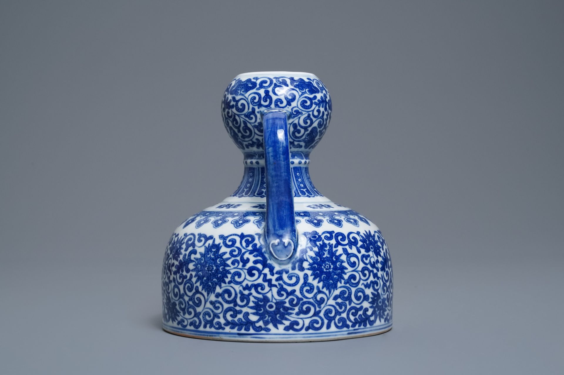 A Chinese blue and white two- Handled 'lotus scroll' jug, Qianlong mark, 19/20th C. - Image 4 of 6