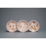 Three Chinese iron red and gilt lotus-moulded plates, Kangxi
