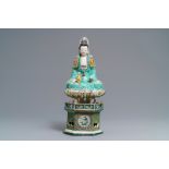 A Chinese verte biscuit group of Guanyin with child on a lotus throne, Kangxi