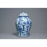 A Chinese blue and white covered vase with floral and landscape panels, Kangxi