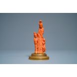 A Chinese carved red coral group of a lady and a girl, 19/20th C.