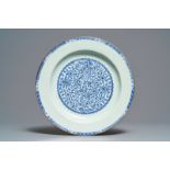 A Chinese blue and white dish with incised rim, Kangxi