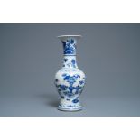 A Chinese blue and white vase with precious objects and floral designs, Kangxi